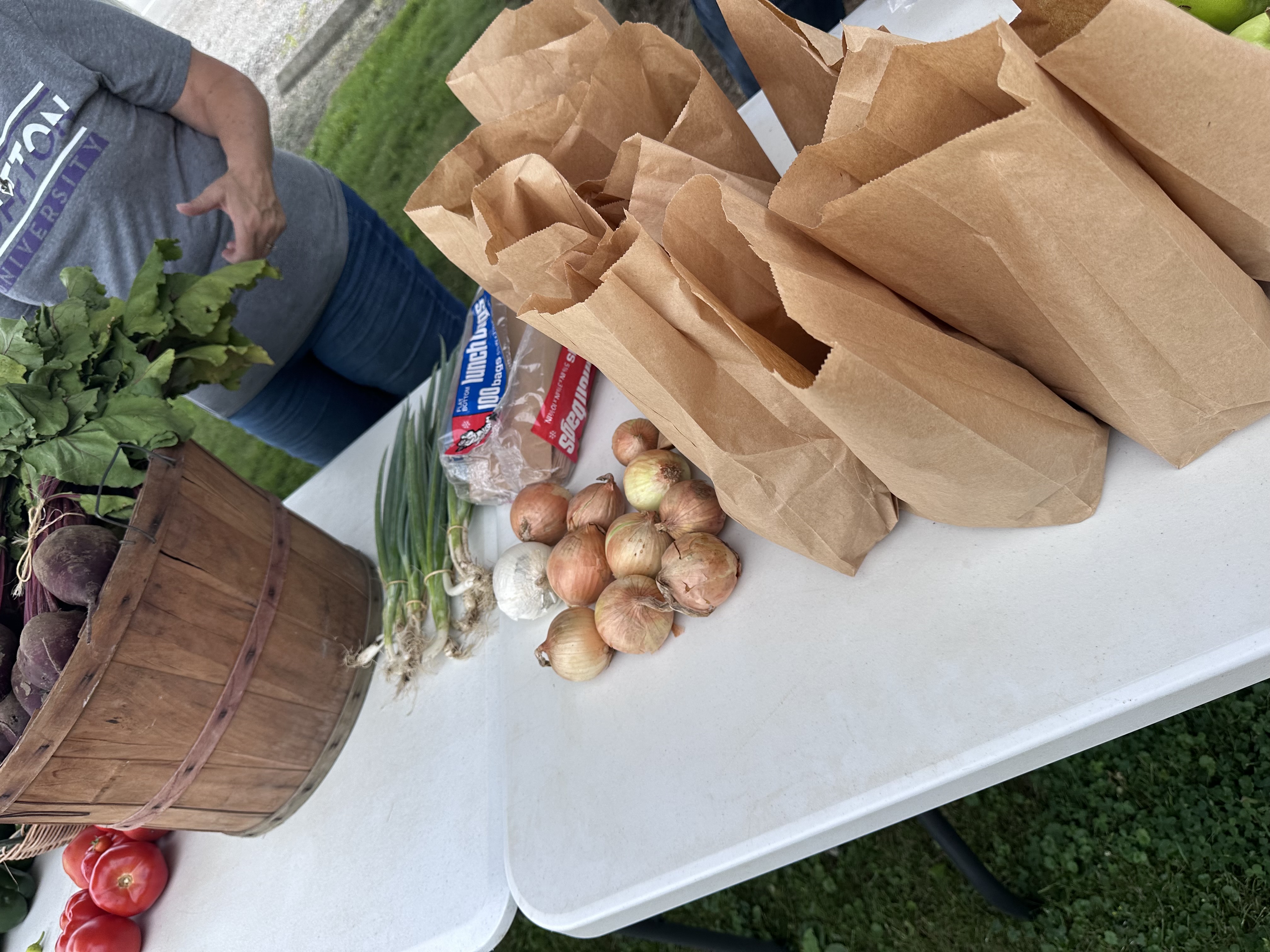 Fresh corn, zucchini, squash, and greens prepared for the giveaway